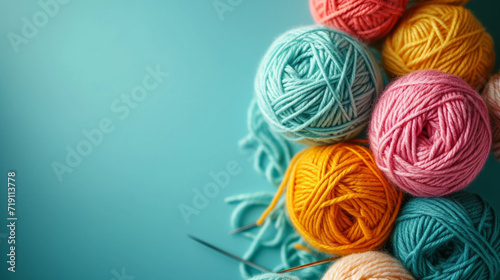 Minimalistic yarn balls background concept with empty space. Vivid color. 
