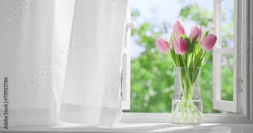 Bouquet of tulip flowers near window