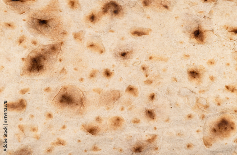 Thin pita bread texture background. Armenian pita bread unleavened flat bread. Top view. Freshly baked homemade oriental bread. Lavash as a textured bread background.