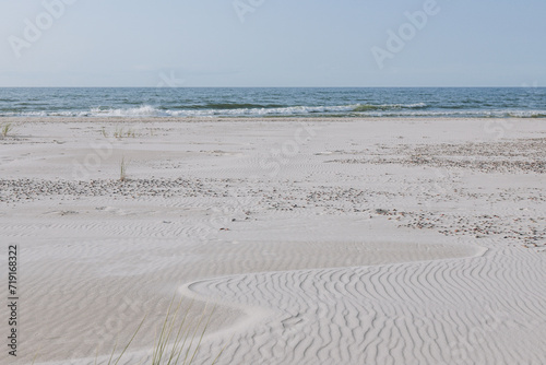 Beautiful landscapes of sand dunes against the background of the ocean. Wavy sand background  dunes and views in Slowinski National Park  Leba  Poland. 