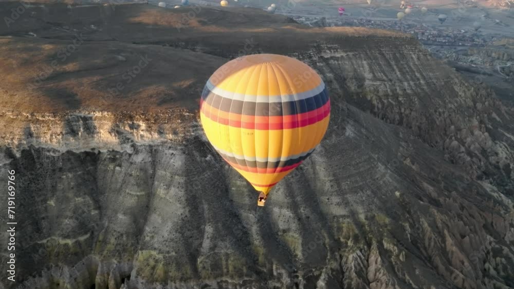 Hot air balloon flight in Goreme in Turkey during sunrise. Ride in a ...