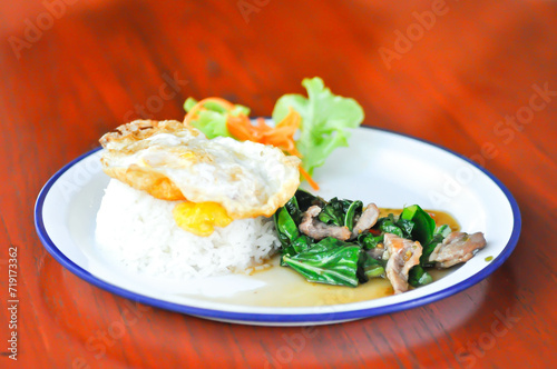 stir fried kale with pork and rice, sunny side up egg