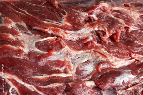 the texture of venison in close-up. Part of the carcass, neck with streaks of fat. Side view