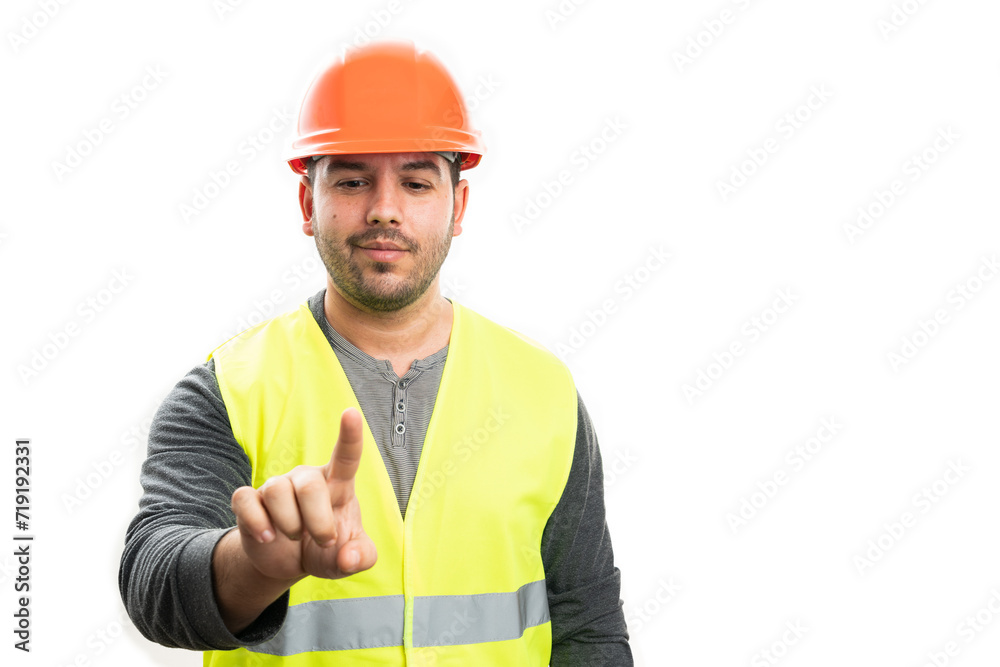 Builder smiling touching copyspace on screen with index finger