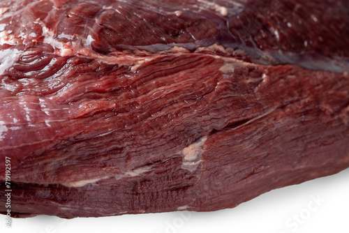 Reindeer meat with thin veins of fat close-up. isolated on a white background