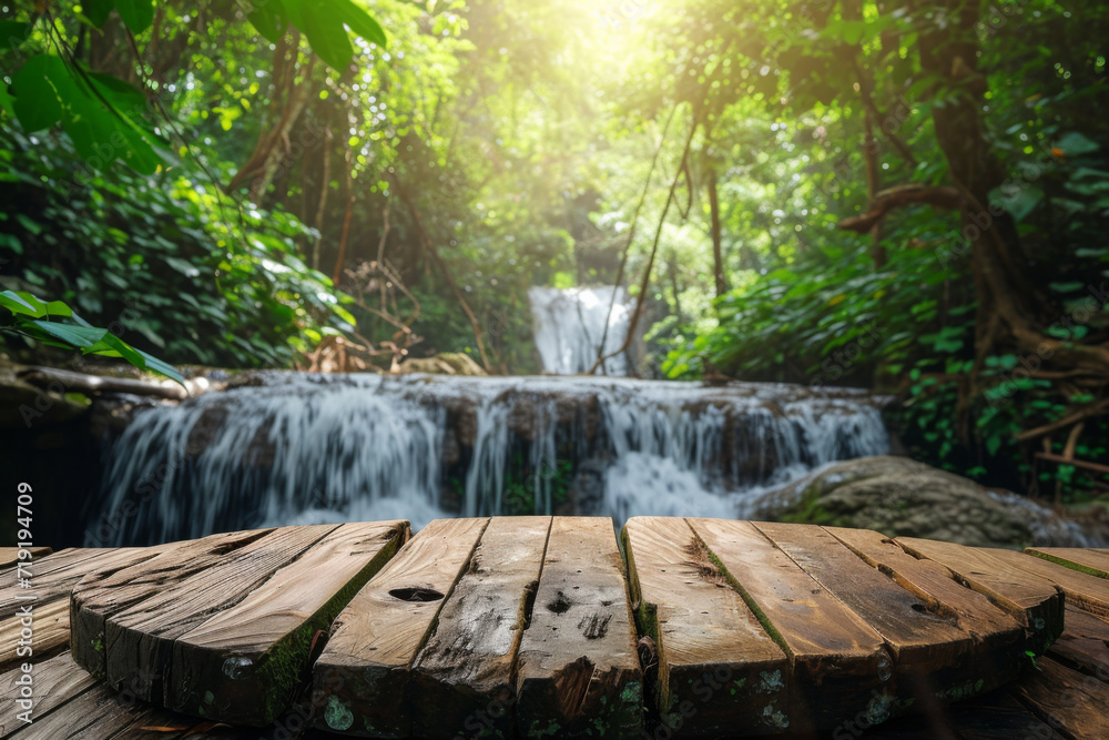 Wood table top podium floor in outdoor waterfall green tropical forest nature background. Wood table top podium floor in outdoor waterfall green tropical forest nature background.