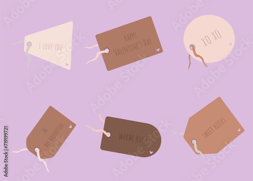 Tags hanging from a drawstrings with the inscriptions and hearts. Holiday labels for valentine's day