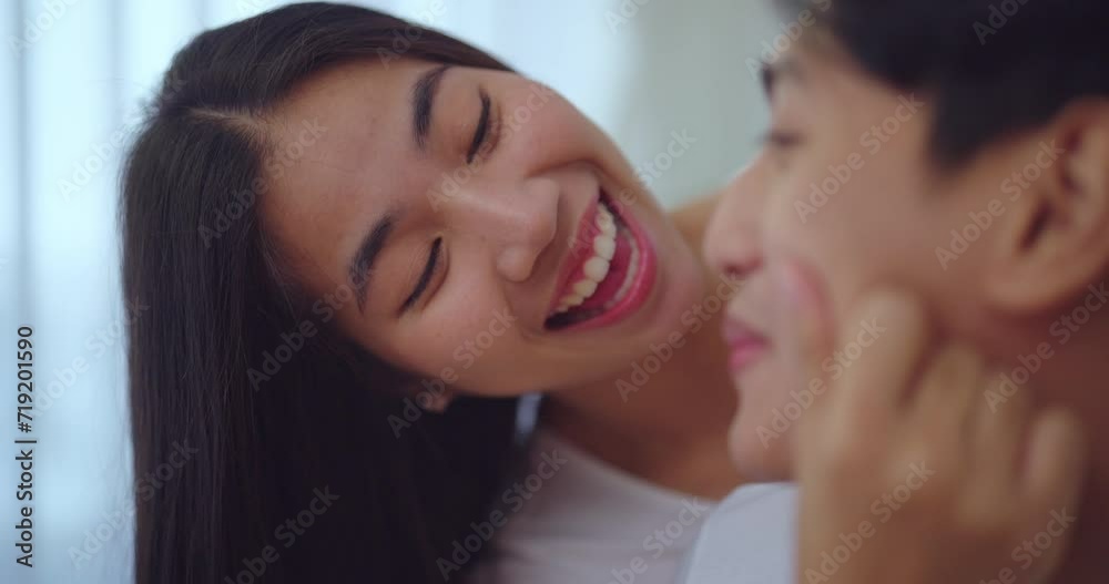 Happiness moment, Young asian couple with happy expression in bedroom at home. They enjoying together with this moment. Happiness moment, Young asian couple with happy expression in bedroom at home. They enjoying together with this moment.