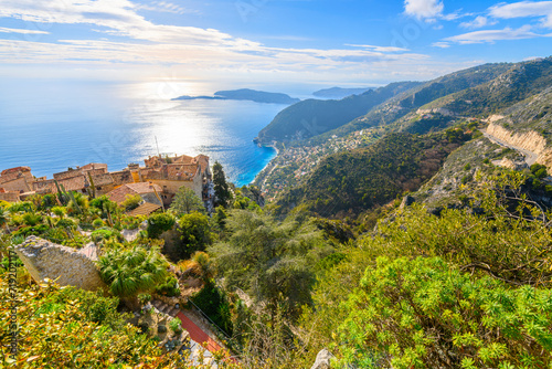 View from the medieval hilltop Eze Village of the Mediterranean sea, hills, coastline and town of Eze, France, along the Cote d'Azur French Riviera of Southern France. photo
