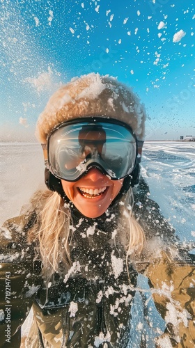 Blonde girl skiing at a resort in the mountains