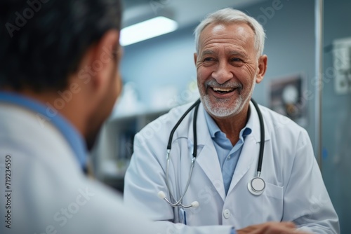 Elderly male doctor talking to patient at hospital