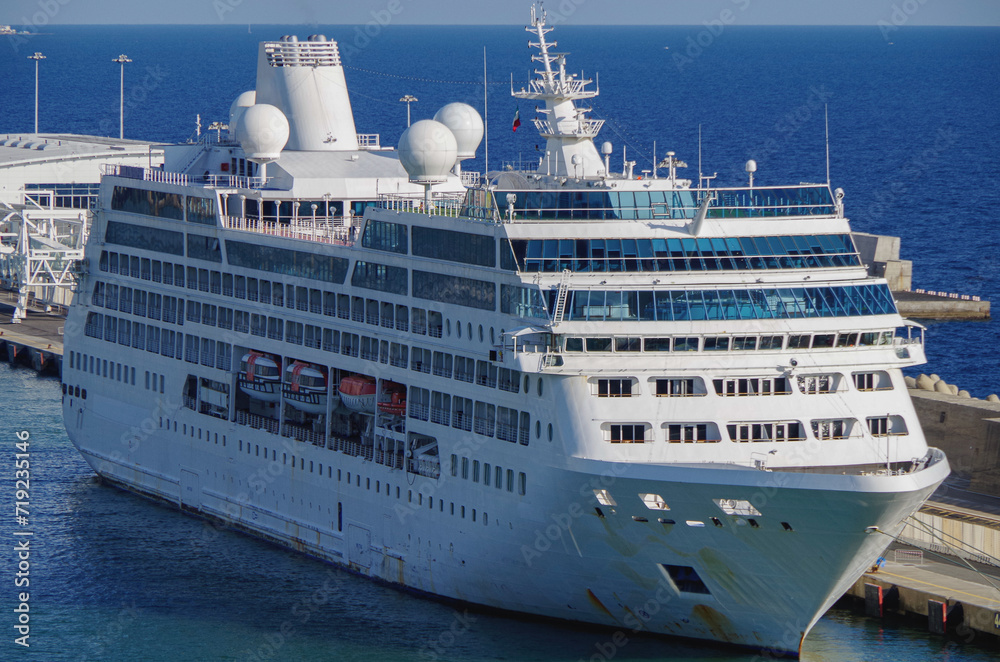 Former Princess cruiseship cruise ship liner Pacific in Civitavecchia Rome port during Summer Mediterranean cruising with other vessels and harbor pier infrastructure