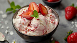 Creamy ice cream decorated with strawberries and mint.
