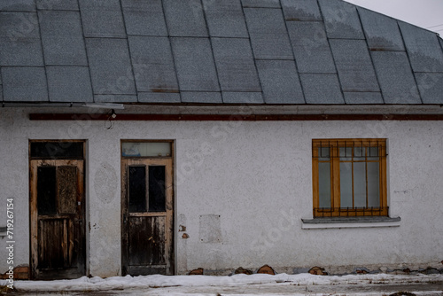 old aged white building with windows © Neils