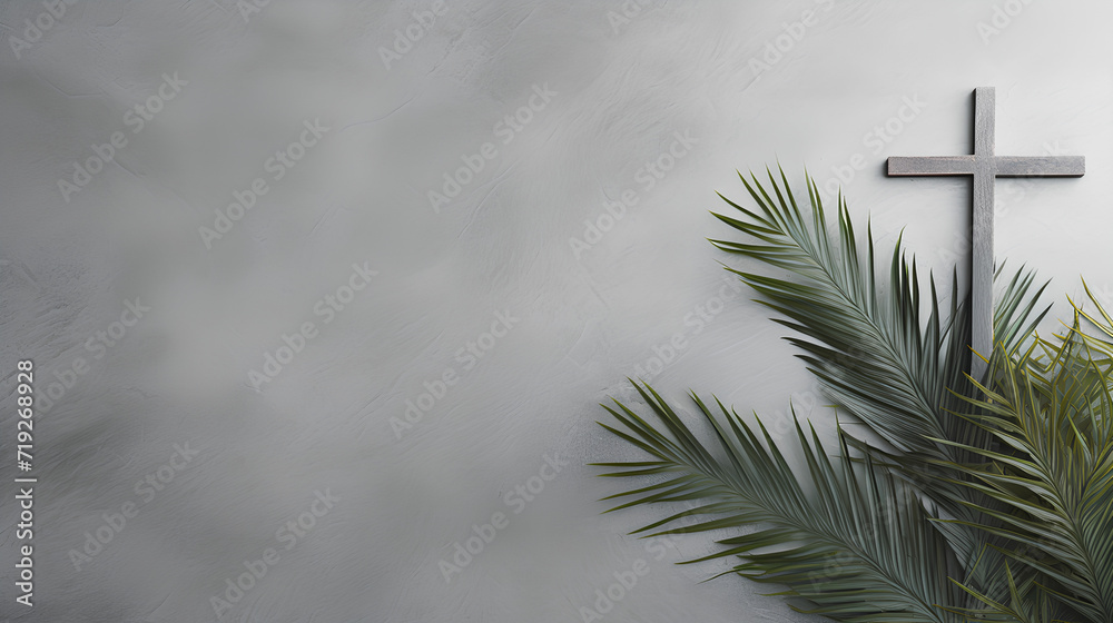 Christian cross and green palm leaf. Gray background. Holy week. Palm Sunday. - obrazy, fototapety, plakaty 