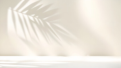 Blurred shadow from palm leaves on light cream wall. Minimalistic beautiful summer spring background for product presentation.