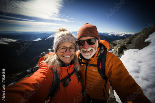 Active sport healthy lifestyle concept. Selfie portrait of adult active shouting mature couple sledding skiing in glasses look happy on top of mountains winter day time. Vacation travel concept
