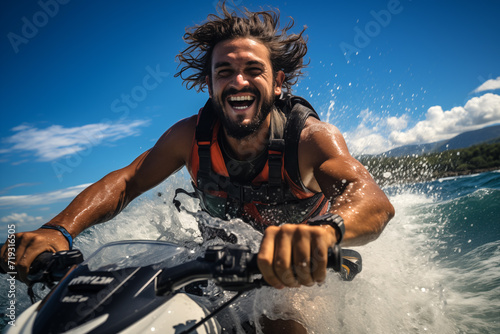 Young man on a jet ski splashing water on a sunny day photo