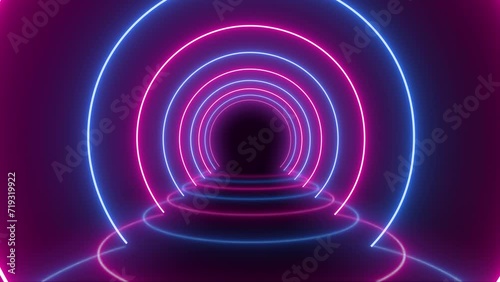 Neon light in circle pink blue glowing on dark background in seamless loop animation