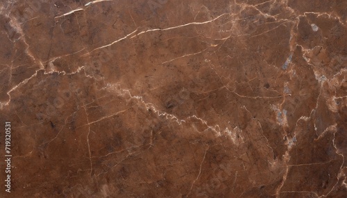 worn brown marble or cracked concrete background as an abstract brown vintage background © Patti