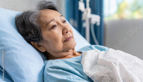 elderly woman, old woman lying in bed