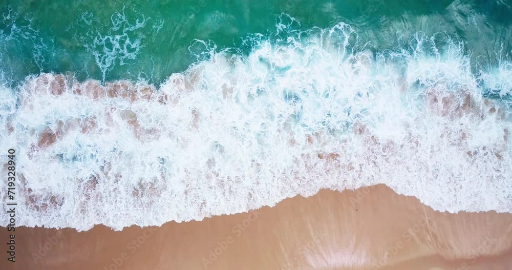 Top-view Beach sea wave rolling come in sandy beach