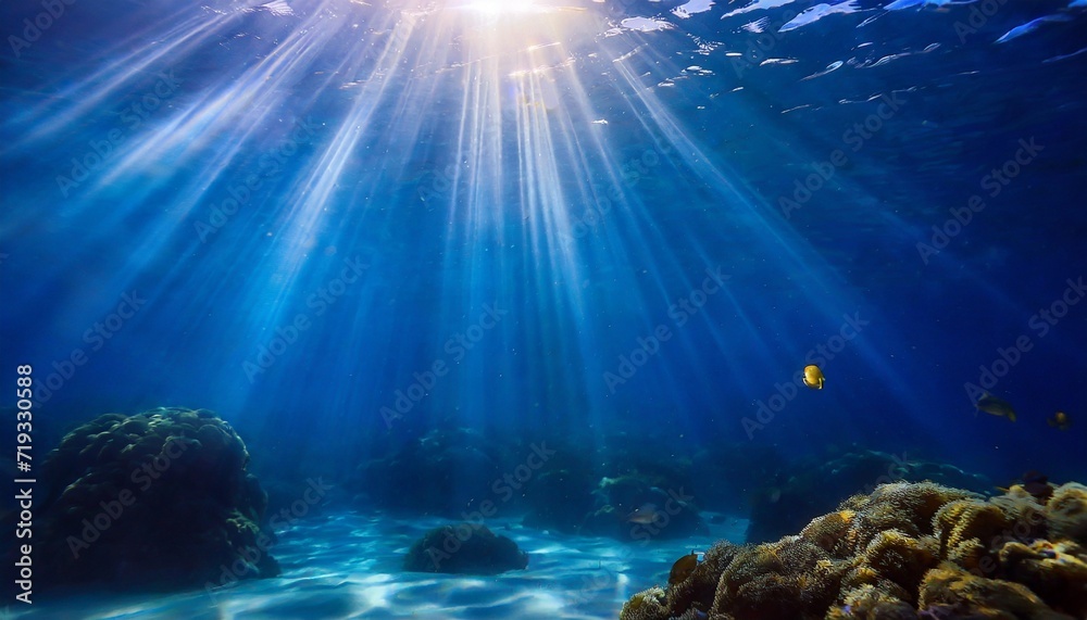 abstract image of tropical underwater dark blue deep ocean wide nature background with rays of sunlight