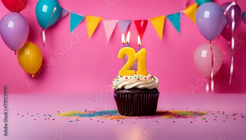 Birthday cupcake with burning lit candle with number 21. Number twentyone for twentyone years or twentyfirst anniversary. photo