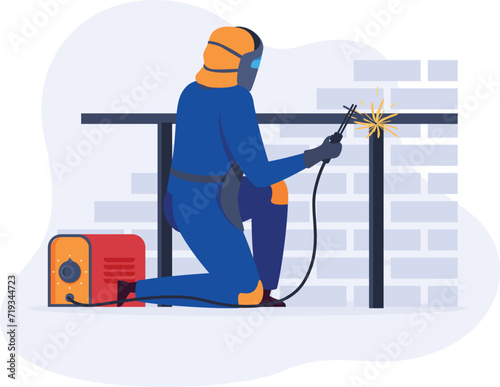 Welder in blue uniform welding metal at construction site, wearing protective helmet and gloves, sparks flying. Skilled worker using welding equipment for building, safety gear on, focused on task.