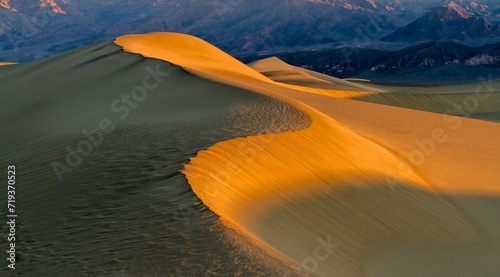 Sunrise at a huge sand dune in Death Valley, CA, USA