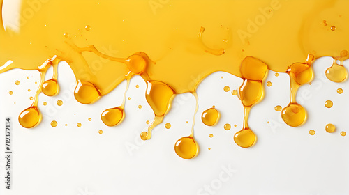 Spots of olive oil isolated on white,,
Natural Honey dripping from wooden drizzler isolated on white. photo