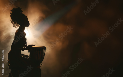 Black african girl silhouette in spot lights and stage smoke playing bongo drums at live music concert with copy space photo