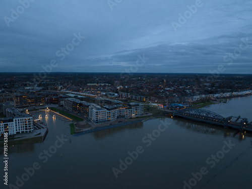 Aerial overview at dusk of the city of Zutphen  along the river Ijssel in Gelderland  The Netherlands. Birds eye aerial drone view in the Dutch province of Gelderland.