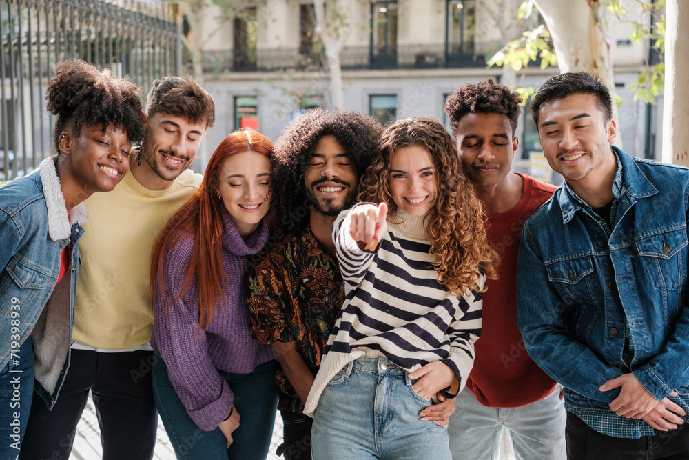 Fototapeta premium Young people together pointing the way while their companions close their eyes. Concept: Choice, trust