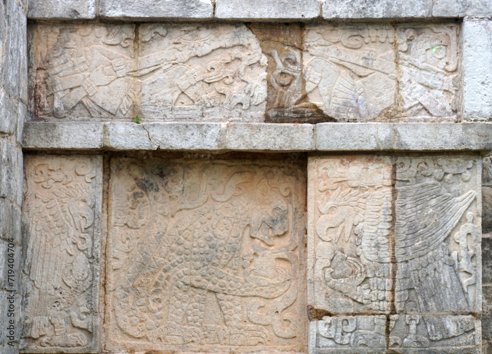 Tulum, Quintana Roo, Mexico - December 15, 2023: Detail of the engravings of the platform of the eagles and jaguars at Chichen Itza.