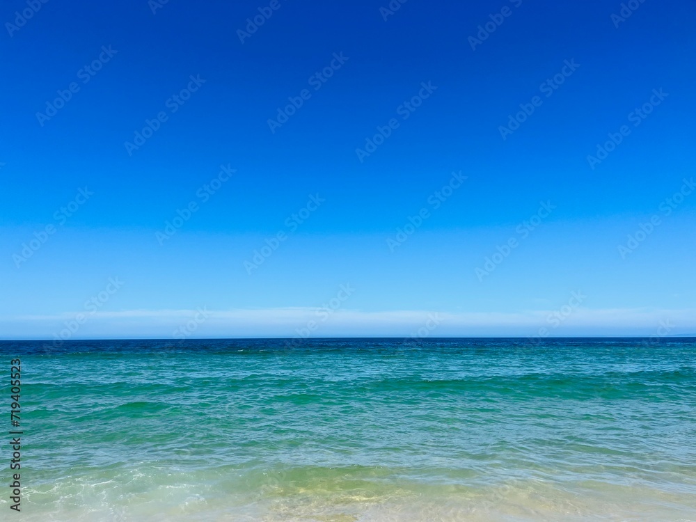 Pure blue sea horizon, blue seascape background, clear sky