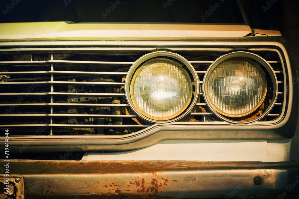 Close up headlight lamp of old classic car.