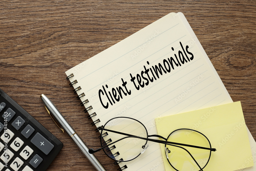 glasses lie on a notepad near the calculator. text Client Testimonials glasses lie on a notepad near the calculator. text Client Testimonials