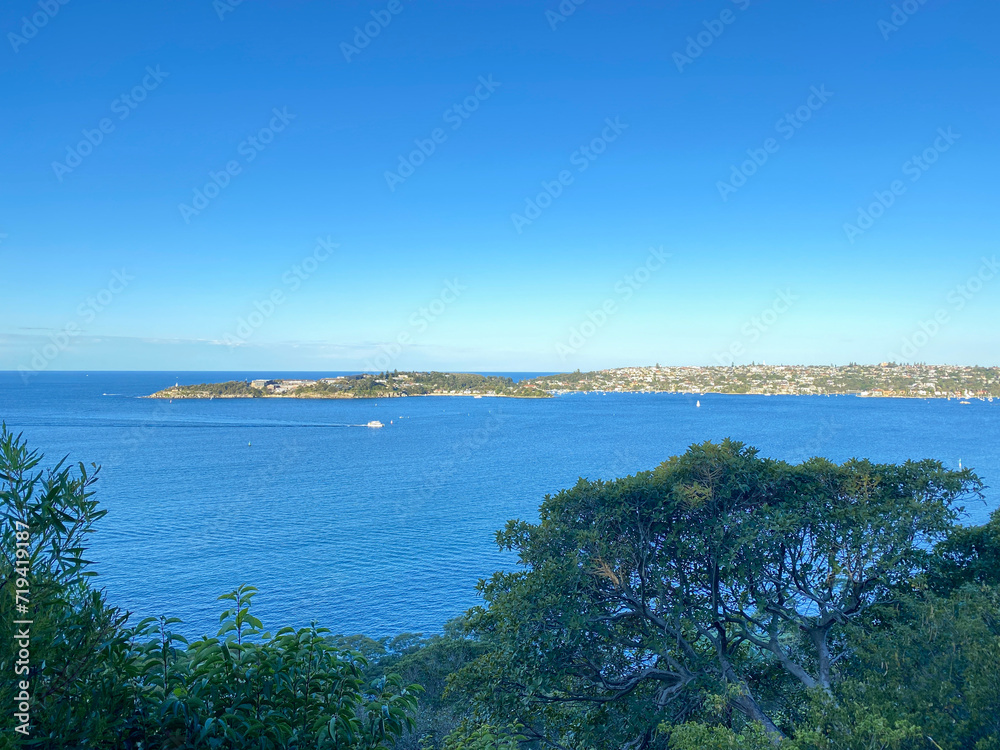 Coast of the ocean form a mountain-top. View of the city in the distance. Landscape and shore, Australia, NSW.
