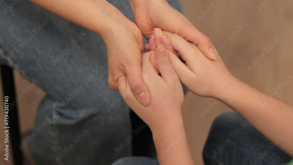 Gentle hands offering comfort to a preadolescent boy, signifying the nurturing role of caregivers in a child's emotional development. Gentle hands offering comfort to a preadolescent boy, signifying the nurturing role of caregivers in a child's emotional development.