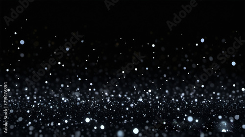Dark background with lots of silver glitter lights and bokeh effects