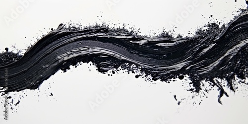 A striking black and white image capturing a wave of paint. This picture can be used to add a dynamic and artistic touch to various design projects