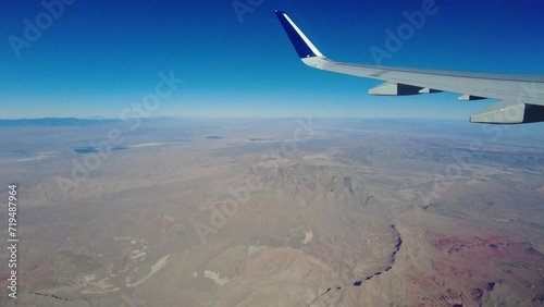 Aircraft window view perspecitive flying over nevada desert colorado usa deserted remote location photo