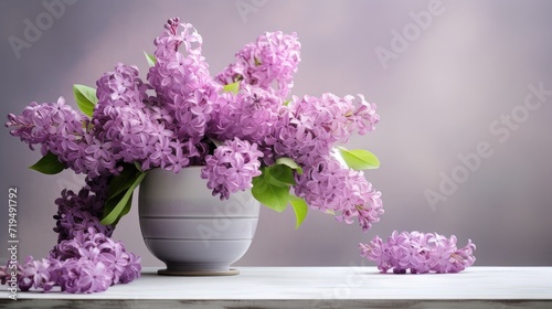 a beautiful bouquet of lilac flowers elegantly arranged in a vintage ceramic cup on a concrete table, with a soft and blurred background adding a touch of nostalgia.