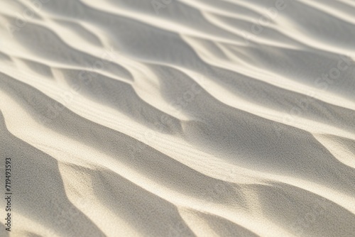 A desert landscape with textured dunes and wavy sand patterns, shaped by the wind © Hamza