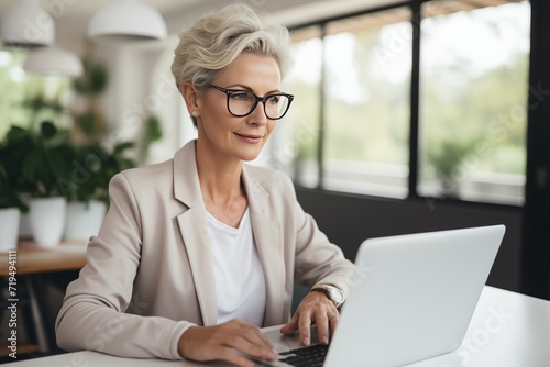 Senior caucasian woman use laptop computer at home for work