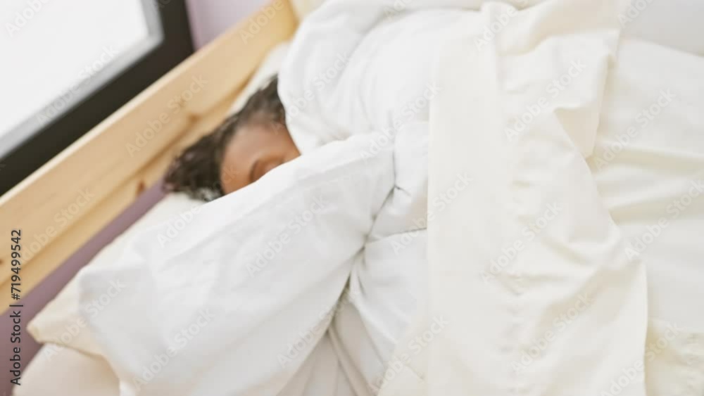 A middle-aged black woman sleeping peacefully in a bright bedroom A middle-aged black woman sleeping peacefully in a bright bedroom