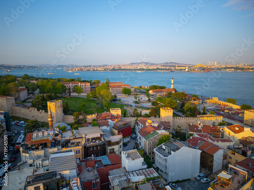 Topkapi Palace and Ahirkapi Lighthouse aerial view at sunset in Sultanahmet with Bosporus Strait at the background in historic city of Istanbul, Turkey. Historic Istanbul is a World Heritage Site. photo