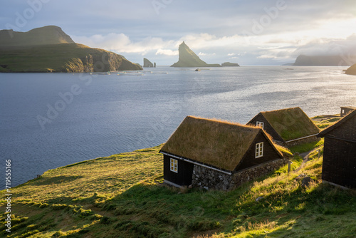 Houses with turf roofs, Bour village, vagar island, faroe islands, denmark, europe
Sunny summer view of Saksun village with typical turf-top houses.
Traveling concept background. photo