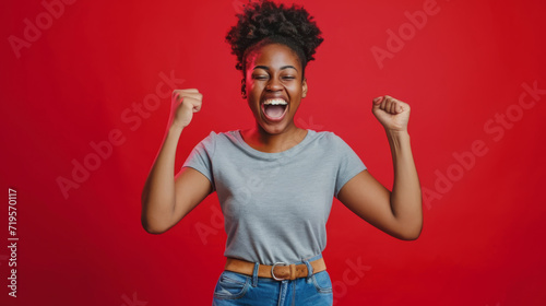 jubilant woman with her arms raised in a celebratory victory pose
